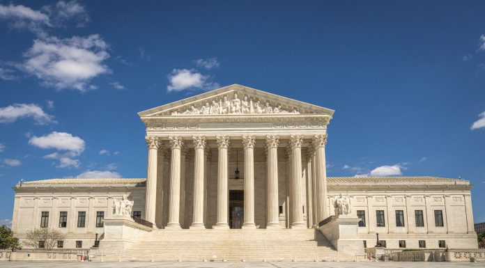 Hoboken Candidate Sues to Get on Ballot After Petitions Fall Short The majestic facade of the United States Supreme Court under a clear blue sky.
