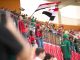 Hoboken Offers Free World Cup Tickets to Local Youth Soccer fans in the stadium wave Egyptian flags, showing their support during a lively sports match.