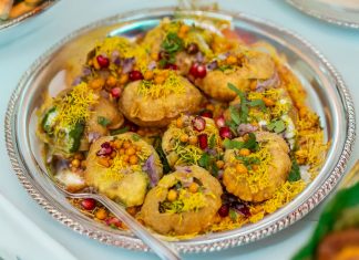 Indian Street Food Chain Opens New Jersey City Location Tempting plate of crunchy Pani Puri topped with colorful garnishes.