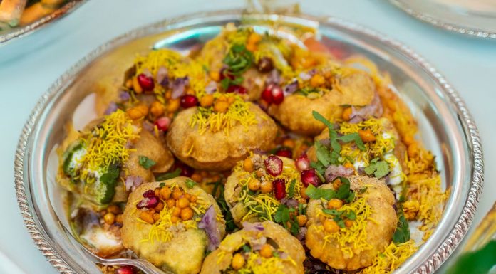 Indian Street Food Chain Opens New Jersey City Location Tempting plate of crunchy Pani Puri topped with colorful garnishes.