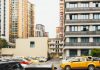 Journal Square Tower Plan Brings 150 Public Parking Spots, Affordable Units High-rise apartment buildings with parked cars in front captured in Sichuan, China.