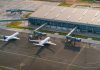 Aerial view of Abeid Amani Karume International Airport in Zanzibar, showing parked airplanes and terminal.