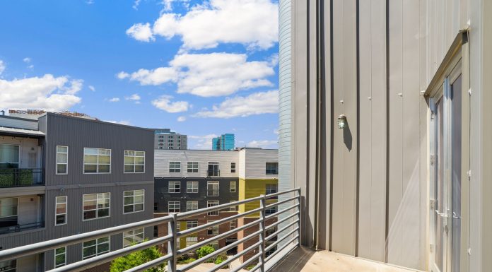 Bright and sunny view of modern urban apartments from a balcony.