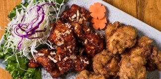 ÚLTIMA HORA: Don Chicken abrirá en Journal Square, Jersey City Close-up of a Korean fried chicken platter with garnishes, perfect for food enthusiasts.