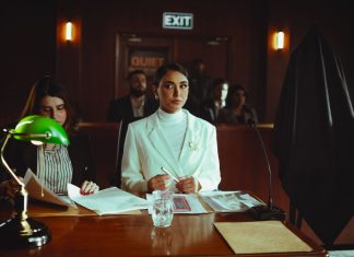 A courtroom scene in Baghdad with lawyers and participants engaged in legal proceedings.