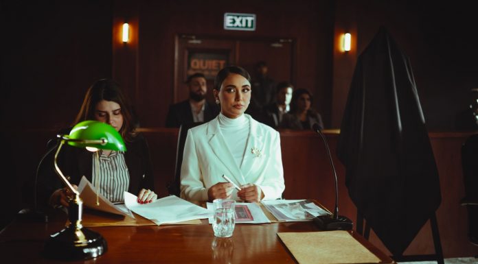 A courtroom scene in Baghdad with lawyers and participants engaged in legal proceedings.