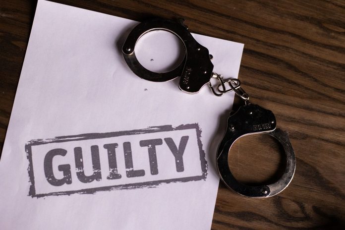 ltima-hora-hombre-de-north-bergen-culpable-por-as Top view of handcuffs on paper with 'GUILTY' text, symbolizing a verdict or crime.