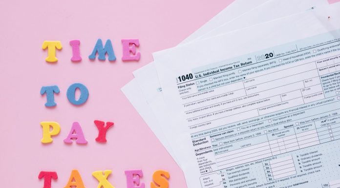 1040 tax forms with colorful 'Time to Pay Taxes' letters.