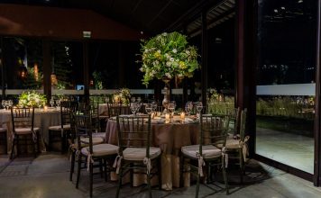 ÚLTIMA HORA: The LOLA lanza cena club fin de semana en Hoboken Luxurious indoor dining scene with floral decorations and elegant table settings.