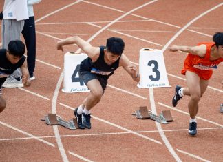 Party With Purpose 5K Returns to Hoboken on July 28 Young male sprinters launching off at the starting line, showcasing athletic determination on the track.