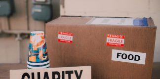 RWJBarnabas Gives $1.3M to Jersey City Nonprofits for Health and Food Aid Image of a charity donation box filled with food supplies and paper cups.