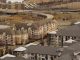 Aerial view of urban residential apartments featuring an American flag, depicting city life.