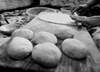 The Kati Roll Company to Open First New Jersey Outpost in Jersey City Black and white image of hands rolling dough in a traditional setting.