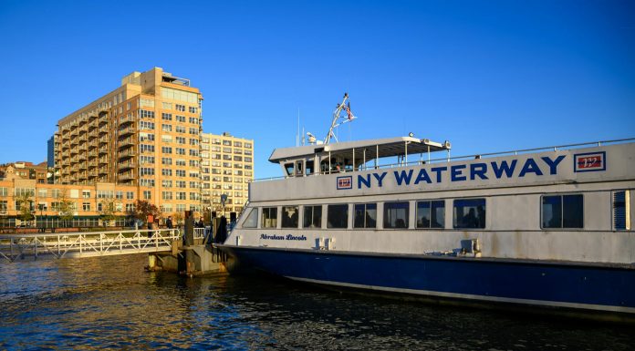 10 Things Locals Love About Living in Hoboken in 2026 NY Waterway ferry docking at Hoboken, NJ against a clear blue sky, showcasing urban architecture.