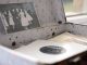 Open vintage floral suitcase with a classic photo and vinyl record inside.