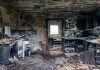 Explore an abandoned, fire-damaged kitchen illustrating decay and destruction.