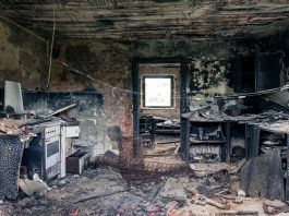 Explore an abandoned, fire-damaged kitchen illustrating decay and destruction.