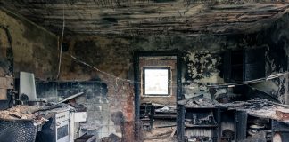 Explore an abandoned, fire-damaged kitchen illustrating decay and destruction.