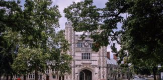 Explore the iconic gothic architecture of Princeton University, surrounded by lush greenery.