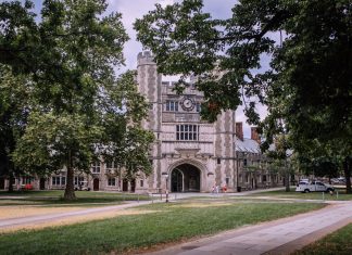 Explore the iconic gothic architecture of Princeton University, surrounded by lush greenery.