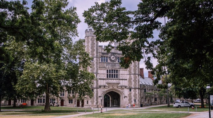 Explore the iconic gothic architecture of Princeton University, surrounded by lush greenery.