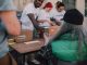 A Year of Giving: Jersey City Nonprofit Celebrates Anniversary on MLK Drive Volunteers handing out donations and support to those in need at a community event.