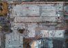 Drone shot of a large vacant lot in Scotland, showcasing concrete and debris.