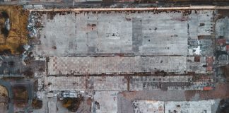 Bayonne Planning Board to Weigh 165-Unit Peninsula View Project Drone shot of a large vacant lot in Scotland, showcasing concrete and debris.