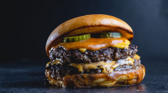 Best Burgers in Elizabeth: A Local’s Guide to the Juiciest, Messiest, and Most Creative Patties in 2026 Mouth-watering beef cheeseburger with pickles, perfect for gourmet food photography.