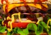 Mouth-watering close-up of a cheeseburger with toppings, showcasing textures and rich flavors.