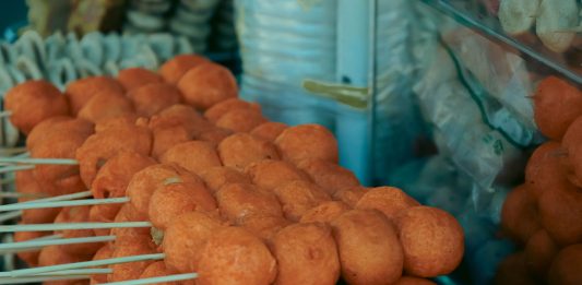 Best Cheap Eats in Newark Under $15: A 2026 Local’s Guide to Affordable Food Close-up of skewered fried street food balls, perfect for food and travel visuals.