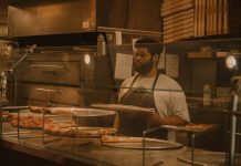 Best Pizza in North Bergen in 2026: A Local’s Guide to the Slice Pizza chef serving slices in a Milwaukee pizzeria, captured in warm tones.