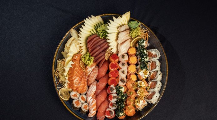 Vibrant sushi platter featuring assorted rolls and fresh sashimi beautifully arranged.