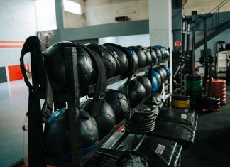 Well-equipped indoor gym featuring kettlebells, weights, and workout gear, perfect for fitness enthusiasts.