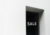 BREAKING: 99¢ Dream on Newark Ave to Close for Mixed-Use Project A minimalist black and white image of a sale sign on a store window with ample negative space.