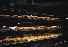 BREAKING: Dän Bakery + Cafe Opening Soon in Hoboken A variety of freshly baked pastries and breads in a glass display case at a bakery.