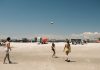 BREAKING: Free New Jersey Beaches Guide for Hudson County Residents A lively beach volleyball game under a clear sky at Cape May, New Jersey.