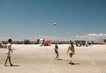 BREAKING: Free New Jersey Beaches Guide for Hudson County Residents A lively beach volleyball game under a clear sky at Cape May, New Jersey.
