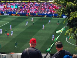 Engaging view of soccer fans enjoying a live match at a stadium in Langford, BC, Canada.
