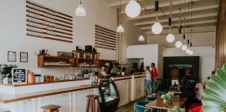 Inviting coffee shop with modern design, customers enjoying drinks, and stylish decor.