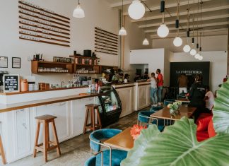Inviting coffee shop with modern design, customers enjoying drinks, and stylish decor.