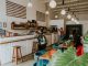 BREAKING: Gemini Cafe Opens in Jersey City’s Van Vorst Park Area Inviting coffee shop with modern design, customers enjoying drinks, and stylish decor.