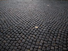 Detailed view of cobblestone pavement pattern in Katowice, Poland, highlighting its historic charm.