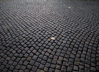 Detailed view of cobblestone pavement pattern in Katowice, Poland, highlighting its historic charm.