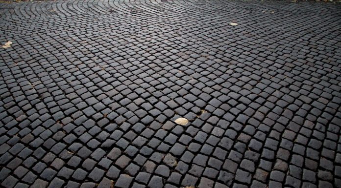 Detailed view of cobblestone pavement pattern in Katowice, Poland, highlighting its historic charm.