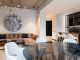 Spacious modern living room with chic decor and open kitchen setup. Perfect for interior design inspiration.