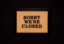 BREAKING: Nike Store in Hoboken Permanently Closes Black-framed 'Sorry We're Closed' sign against a dark backdrop, ideal for business themes.
