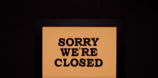 BREAKING: Nike Store in Hoboken Permanently Closes Black-framed 'Sorry We're Closed' sign against a dark backdrop, ideal for business themes.