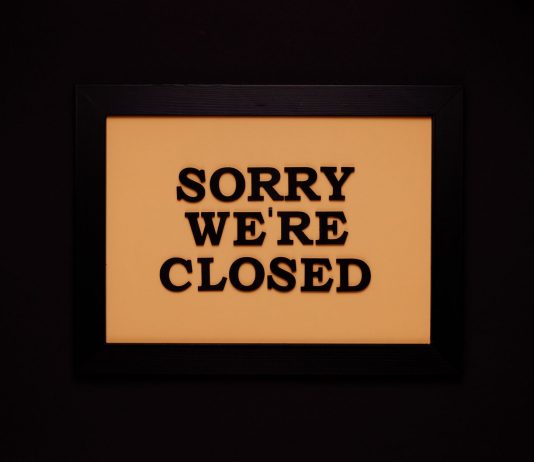 BREAKING: Nike Store in Hoboken Permanently Closes Black-framed 'Sorry We're Closed' sign against a dark backdrop, ideal for business themes.