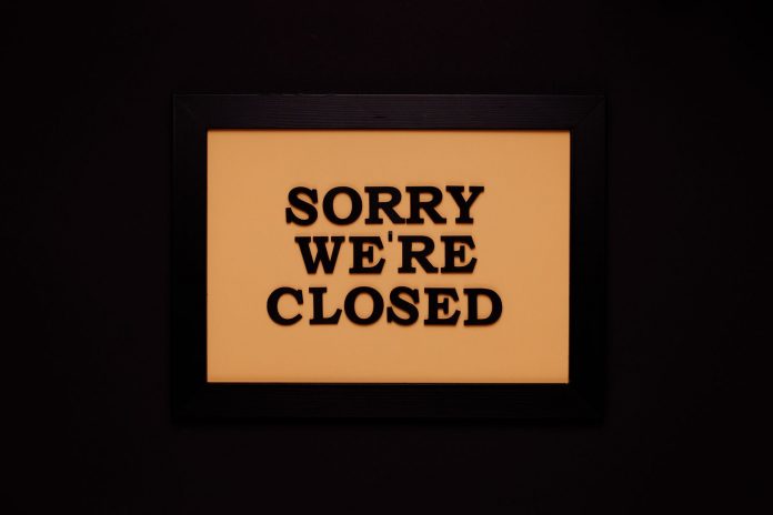 breaking-nike-store-in-hoboken-permanently-closes Black-framed 'Sorry We're Closed' sign against a dark backdrop, ideal for business themes.